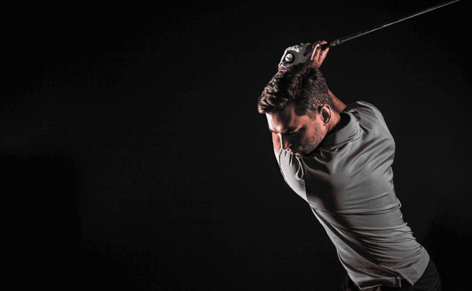 Golfer Mid Swing Dark Background Studio