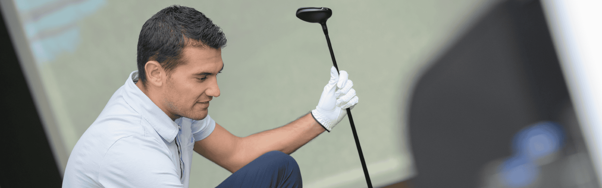 Golfer Preparing With Driver At Simulator