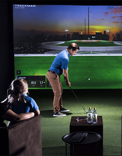 Family in Trackman simulator bay