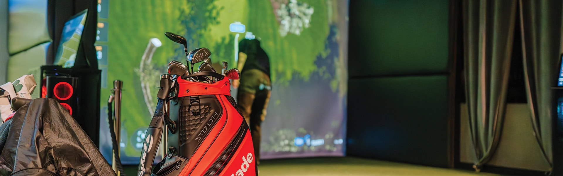 Taylormade Bag In Simulator Bay With Player